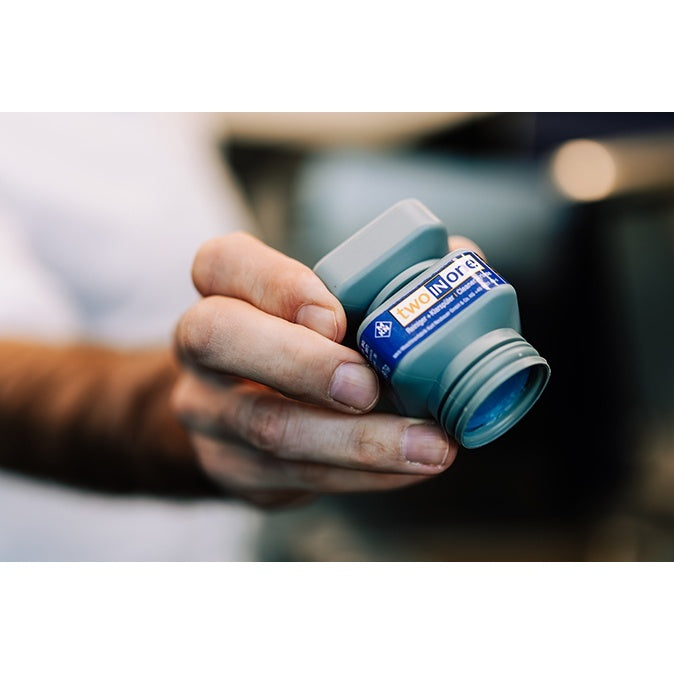 Hand holding MKN WaveClean two-in-one cleaning cartridge